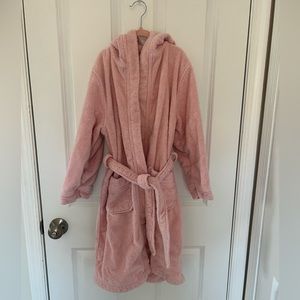 Pink terry cloth Linim Kids hooded robe with waist tie.